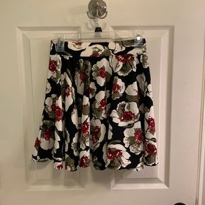 Black, red, and white skirt.